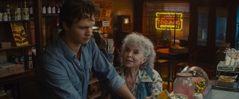 Movie still from “West Side Story” (2021), directed by Steven Spielberg – An older woman and a young man in a room; Close Up shot, Over the shoulder angle