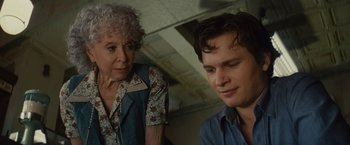 Movie still from “West Side Story” (2021), directed by Steven Spielberg – A woman and a young man sitting next to each other; Close Up shot, Over the shoulder angle