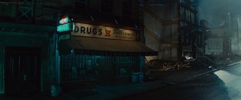 Movie still from “West Side Story” (2021), directed by Steven Spielberg – A drug store at night in the dark; Extreme Wide shot, Low angle