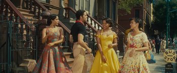 Movie still from “West Side Story” (2021), directed by Steven Spielberg – A group of people standing next to each other on steps; Medium shot, Over the shoulder angle