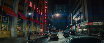 Movie still from “West Side Story” (2021), directed by Steven Spielberg – A city street filled with lots of traffic at night; Extreme Wide shot, Over the shoulder angle