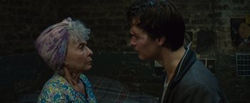 Movie still from “West Side Story” (2021), directed by Steven Spielberg – An older woman and a younger man face to face; Close Up shot, Over the shoulder angle