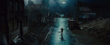 Movie still from “West Side Story” (2021), directed by Steven Spielberg – A man standing in the middle of a street; Extreme Wide shot, High angle