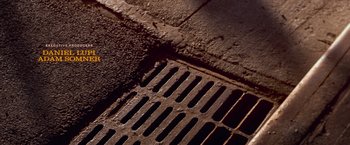 Movie still from “West Side Story” (2021), directed by Steven Spielberg – A grate on the sidewalk; Extreme Close Up shot, Overhead angle