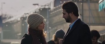 Movie still from “What's Love Got to Do with It?” (2022), directed by Shekhar Kapur – A man and a woman standing next to each other on the street; Close Up shot, Over the shoulder angle