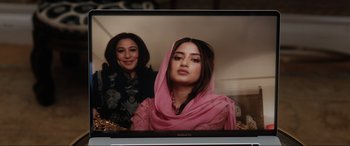 Movie still from “What's Love Got to Do with It?” (2022), directed by Shekhar Kapur – A woman in a pink dress and a woman in a pink veil; Medium shot, Over the shoulder angle