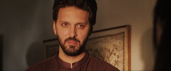 Movie still from “What's Love Got to Do with It?” (2022), directed by Shekhar Kapur – A person with a beard; Close Up shot, Low angle