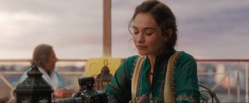 Movie still from “What's Love Got to Do with It?” (2022), directed by Shekhar Kapur – A woman is looking at a video camera; Close Up shot, Over the shoulder angle