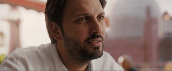 Movie still from “What's Love Got to Do with It?” (2022), directed by Shekhar Kapur – A person with a beard; Close Up shot, Low angle