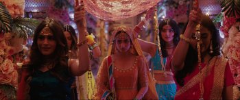 Movie still from “What's Love Got to Do with It?” (2022), directed by Shekhar Kapur – A group of women dressed in traditional indian garb; Wide shot, Over the shoulder angle