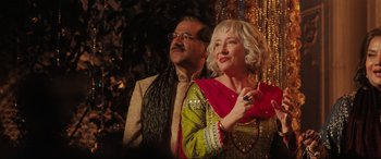 Movie still from “What's Love Got to Do with It?” (2022), directed by Shekhar Kapur – A man and a woman standing next to each other; Medium shot, Low angle