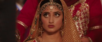 Movie still from “What's Love Got to Do with It?” (2022), directed by Shekhar Kapur – A woman with a veil on her head; Close Up shot, Over the shoulder angle
