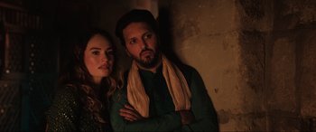 Movie still from “What's Love Got to Do with It?” (2022), directed by Shekhar Kapur – A man and a woman standing next to each other; Medium shot, Low angle