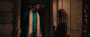 Movie still from “What's Love Got to Do with It?” (2022), directed by Shekhar Kapur – A man and a woman standing next to each other in front of a door; Medium shot, Over the shoulder angle