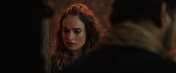 Movie still from “What's Love Got to Do with It?” (2022), directed by Shekhar Kapur – A person with long brown hair; Close Up shot, Over the shoulder angle