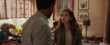 Movie still from “What's Love Got to Do with It?” (2022), directed by Shekhar Kapur – A man and a woman standing next to each other in a room; Medium shot, Over the shoulder angle