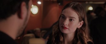 Movie still from “What's Love Got to Do with It?” (2022), directed by Shekhar Kapur – A person wearing a black shirt; Close Up shot, Over the shoulder angle