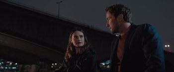 Movie still from “What's Love Got to Do with It?” (2022), directed by Shekhar Kapur – A man and a woman standing next to each other in front of a bridge; Medium shot, Over the shoulder angle