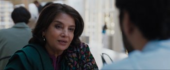 Movie still from “What's Love Got to Do with It?” (2022), directed by Shekhar Kapur – A person sitting at a table; Close Up shot, Over the shoulder angle