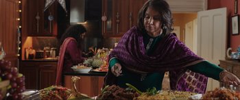 Movie still from “What's Love Got to Do with It?” (2022), directed by Shekhar Kapur – Two women in a kitchen preparing a meal; Medium shot, Over the shoulder angle