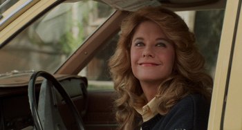 Movie still from “When Harry Met Sally...” (1989), directed by Rob Reiner – A woman sitting in the driver's seat of a car; Close Up shot, Over the shoulder angle