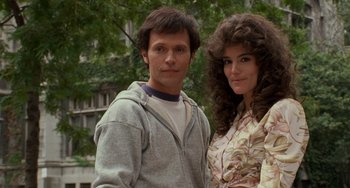 Movie still from “When Harry Met Sally...” (1989), directed by Rob Reiner – A man and a woman standing next to each other in front of a building; Close Up shot, Low angle