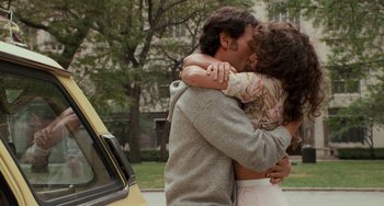 Movie still from “When Harry Met Sally...” (1989), directed by Rob Reiner – A man and a woman hugging in front of a yellow van; Medium shot, Over the shoulder angle