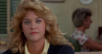 Movie still from “When Harry Met Sally...” (1989), directed by Rob Reiner – A person with long blonde hair; Close Up shot, Over the shoulder angle