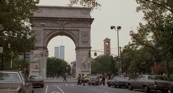 Movie still from “When Harry Met Sally...” (1989), directed by Rob Reiner – People crossing the street in front of a large arch; Extreme Wide shot, Low angle