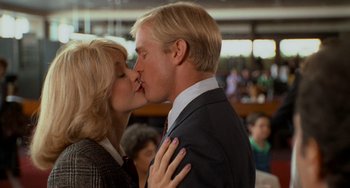Movie still from “When Harry Met Sally...” (1989), directed by Rob Reiner – A man and a woman kissing each other in front of a crowd; Close Up shot, Low angle