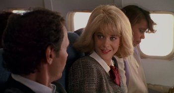 Movie still from “When Harry Met Sally...” (1989), directed by Rob Reiner – A man and a woman sitting on a plane together; Close Up shot, Over the shoulder angle