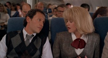 Movie still from “When Harry Met Sally...” (1989), directed by Rob Reiner – A man and a woman sitting next to each other on a plane; Medium shot, Over the shoulder angle