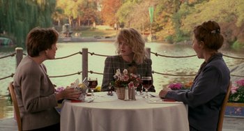 Movie still from “When Harry Met Sally...” (1989), directed by Rob Reiner – A woman sitting at a table in front of two other people; Wide shot, Over the shoulder angle