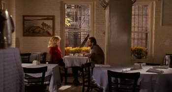 Movie still from “When Harry Met Sally...” (1989), directed by Rob Reiner – A man and a woman sitting at a table in front of a window; Wide shot, Over the shoulder angle