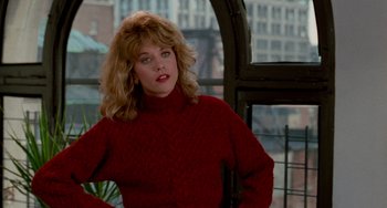 Movie still from “When Harry Met Sally...” (1989), directed by Rob Reiner – A woman in a red sweater sitting on a chair; Medium shot, Over the shoulder angle