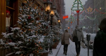 Movie still from “When Harry Met Sally...” (1989), directed by Rob Reiner – Two people walking down a snowy street holding hands; Wide shot, Low angle