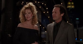 Movie still from “When Harry Met Sally...” (1989), directed by Rob Reiner – A man and a woman standing next to each other in front of lights; Medium shot, Over the shoulder angle