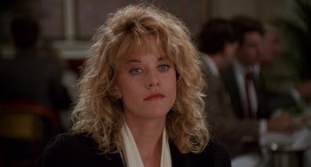 Movie still from “When Harry Met Sally...” (1989), directed by Rob Reiner – A person wearing a suit and tie; Close Up shot, Over the shoulder angle
