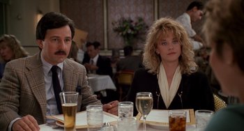 Movie still from “When Harry Met Sally...” (1989), directed by Rob Reiner – A man and a woman sitting at a dinner table; Medium shot, Low angle