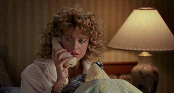 Movie still from “When Harry Met Sally...” (1989), directed by Rob Reiner – A woman sitting in bed talking on the phone; Close Up shot, High angle