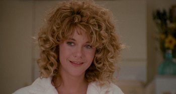 Movie still from “When Harry Met Sally...” (1989), directed by Rob Reiner – A person wearing a white shirt with curly hair; Close Up shot, Over the shoulder angle