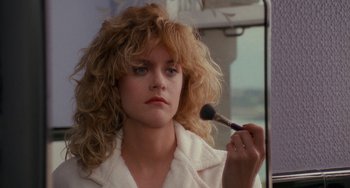 Movie still from “When Harry Met Sally...” (1989), directed by Rob Reiner – A woman is putting makeup on her face; Close Up shot, Over the shoulder angle