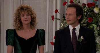 Movie still from “When Harry Met Sally...” (1989), directed by Rob Reiner – A man and a woman standing next to each other in front of roses; Medium shot, Over the shoulder angle