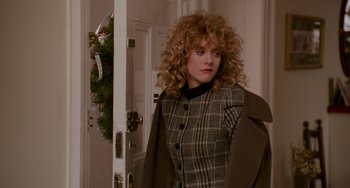 Movie still from “When Harry Met Sally...” (1989), directed by Rob Reiner – A woman standing in front of a door wearing a coat; Medium shot, Over the shoulder angle