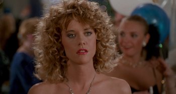 Movie still from “When Harry Met Sally...” (1989), directed by Rob Reiner – A person with curly hair wearing a necklace; Close Up shot, Over the shoulder angle
