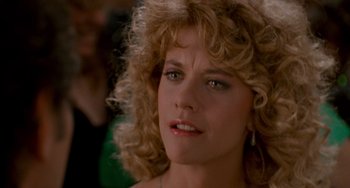 Movie still from “When Harry Met Sally...” (1989), directed by Rob Reiner – A person with curly blonde hair; Close Up shot, Over the shoulder angle