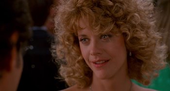 Movie still from “When Harry Met Sally...” (1989), directed by Rob Reiner – A person with curly blonde hair; Close Up shot, Over the shoulder angle