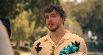 Movie still from “White Men Can't Jump” (2023), directed by Calmatic – A person wearing a shirt; Close Up shot, Over the shoulder angle