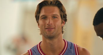 Movie still from “White Men Can't Jump” (2023), directed by Calmatic – A person wearing a basketball uniform; Close Up shot, Over the shoulder angle