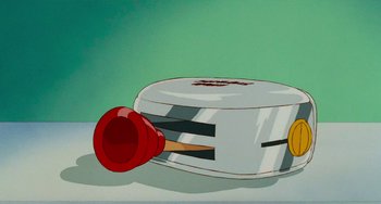 Movie still from “Who Framed Roger Rabbit” (1988), directed by Robert Zemeckis – An illustration of a paintbrush in a can; Extreme Close Up shot, Overhead angle